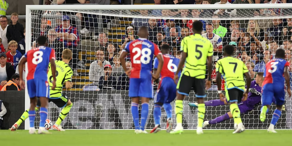 Arsenal clinches a 1-0 victory over Crystal Palace with Odegaard's penalty, joining City and Brighton at the Premier League's summit.