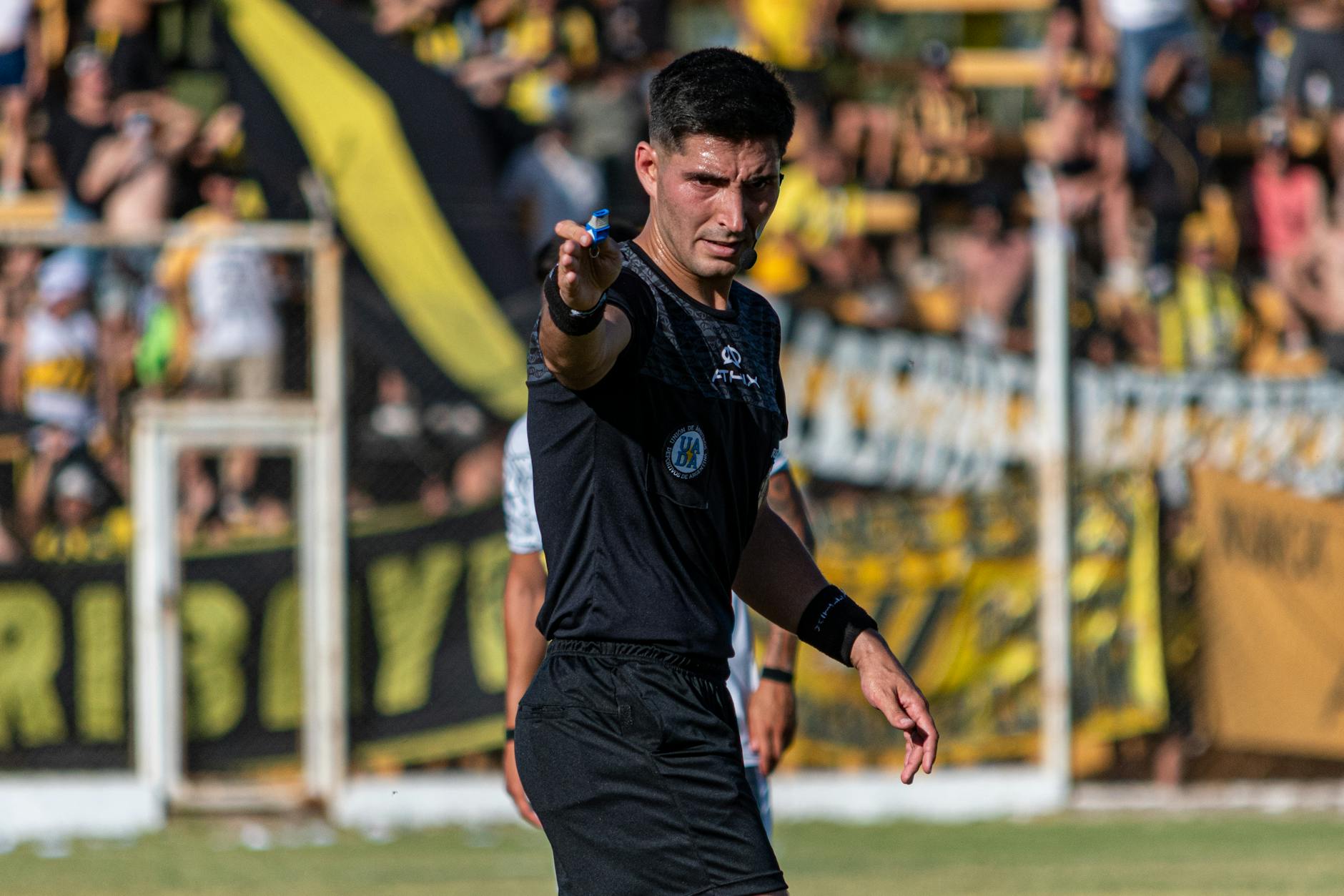 soccer referee making a call during match