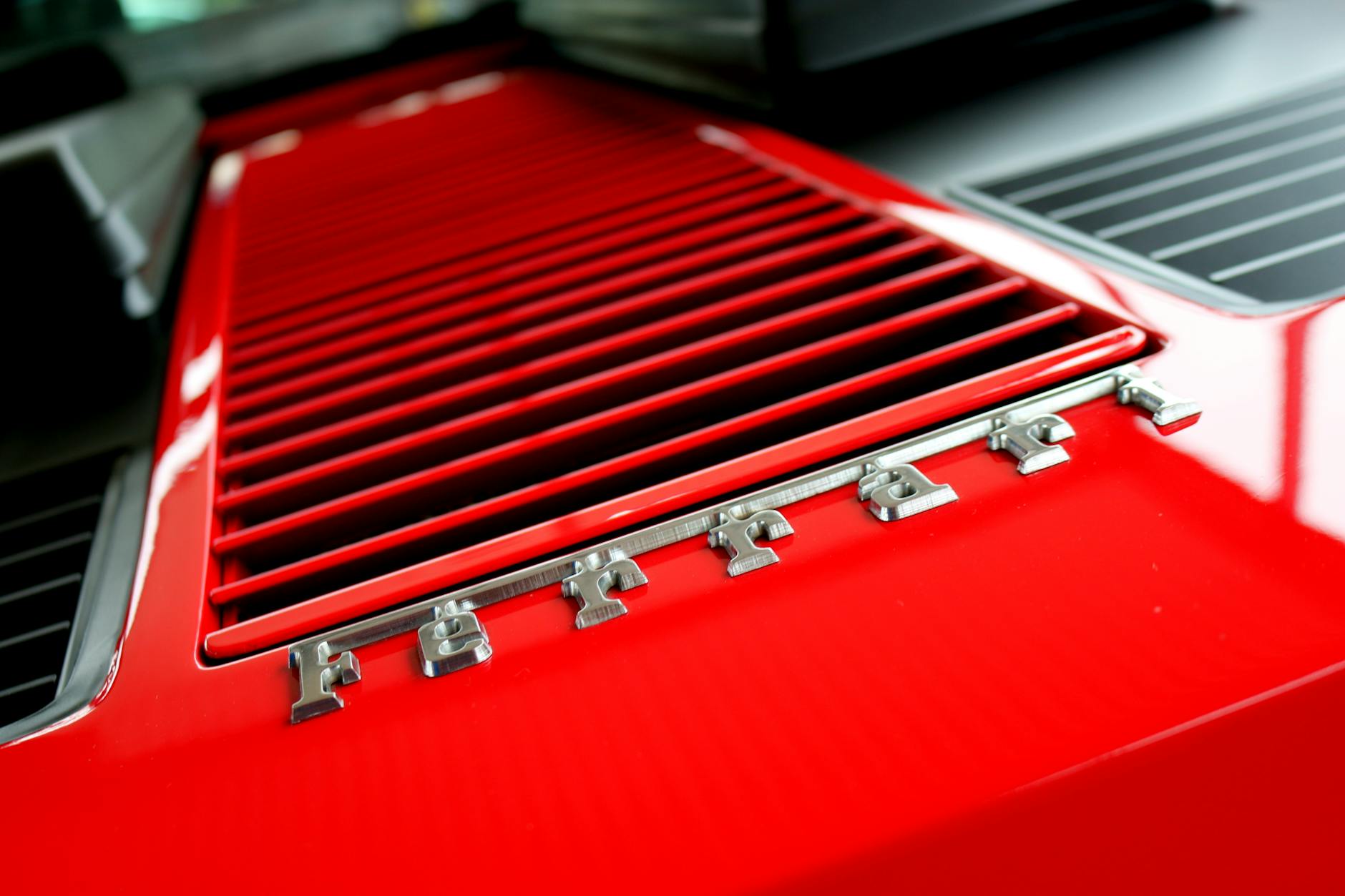 close up photography of red metal grille