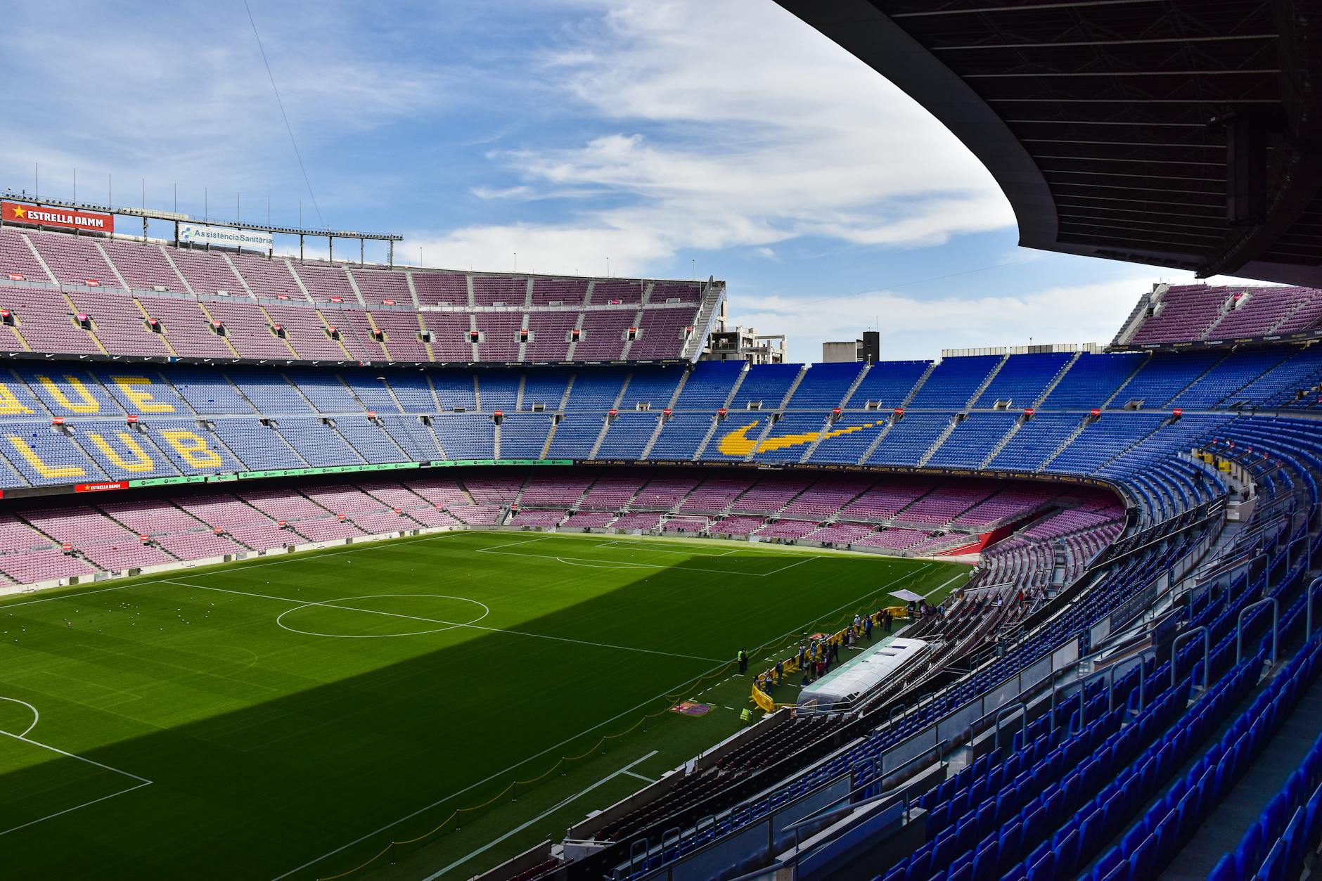the inside of a soccer stadium with blue seats